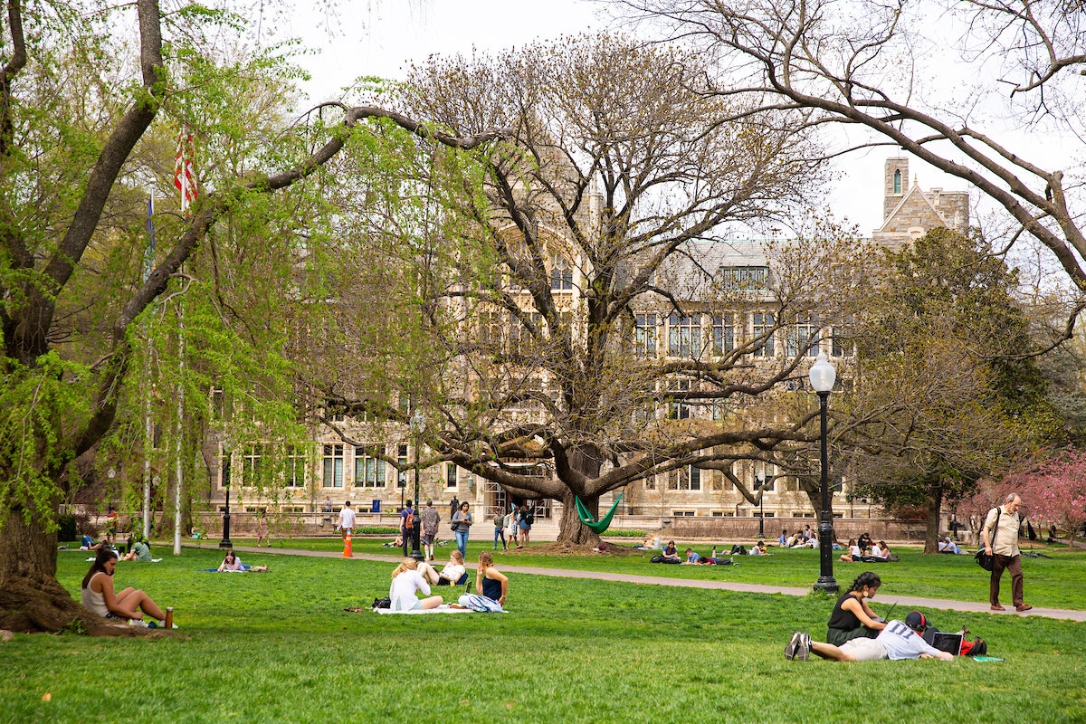 students relaxing on Copley lawn in spring